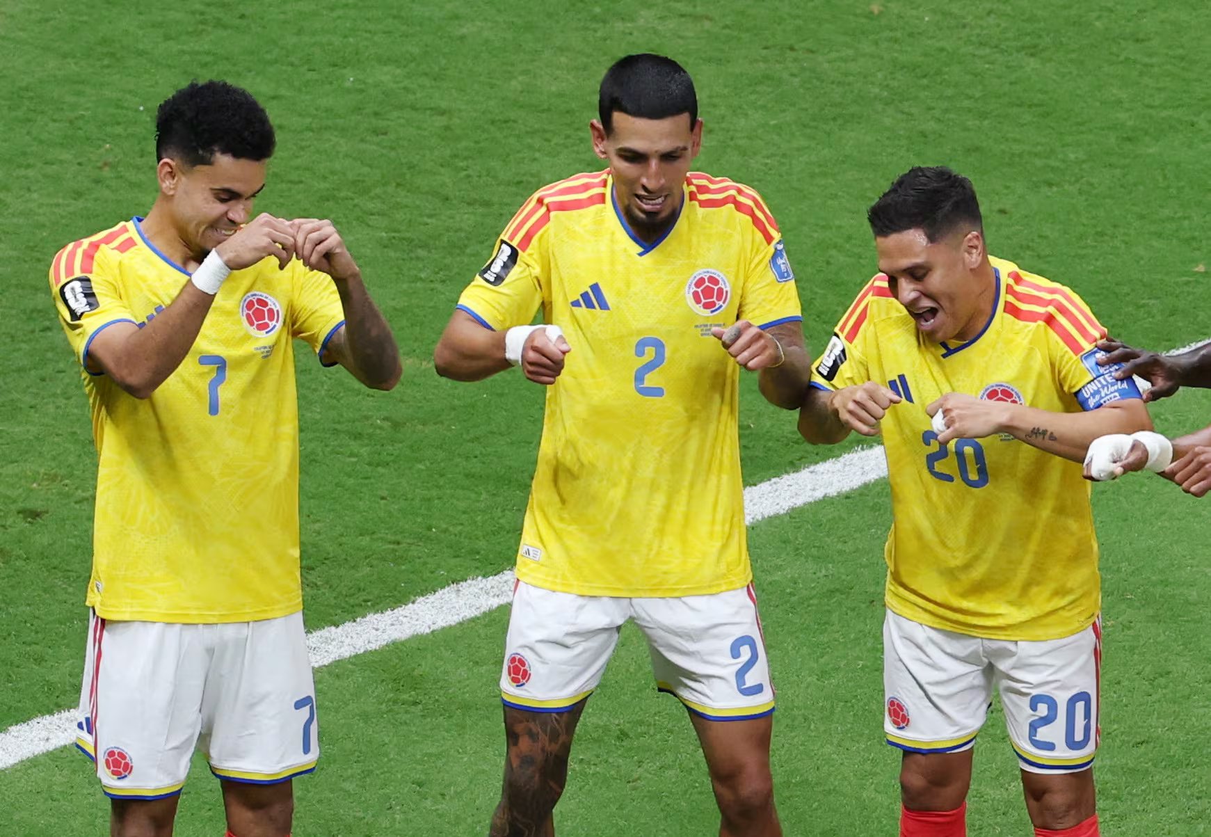 Soccer Football - FIFA World Cup 2026 - Group K - Colombia v DR Congo - Estadio Guadalajara, Guadalajara, Mexico - June 23, 2026 Colombia's Daniel Munoz celebrates scoring their first goal with Luis Diaz and Juan Quintero REUTERS/Raquel Cunha