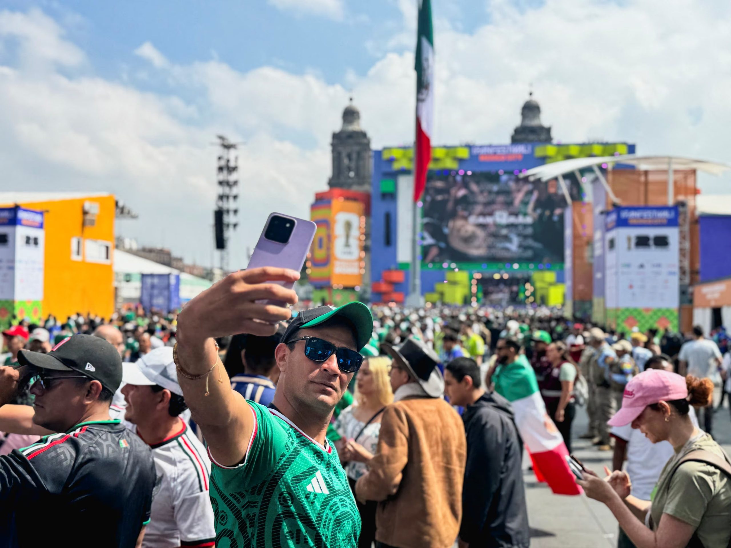 A fan takes a picture at Zocalo square on the day of the opening match of the 2026 FIFA World Cup in Mexico City, Mexico, June 11, 2026. Picture taken with a mobile phone. REUTERS/Simon Gardner